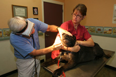 Penny gets an exam after cancer treatment.